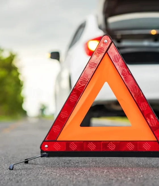 car pulled over with hazard sign.