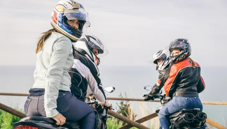 Two couples on motorcycles on road trip through Georgia.