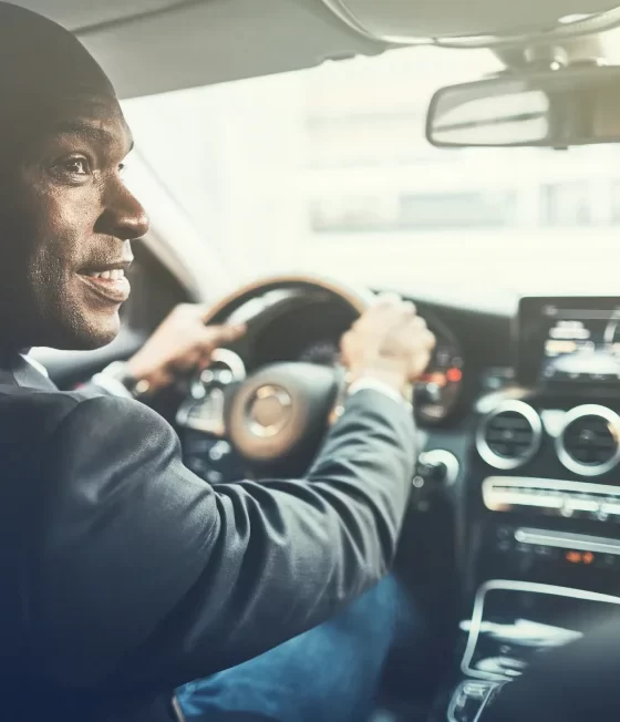 african american man driving car