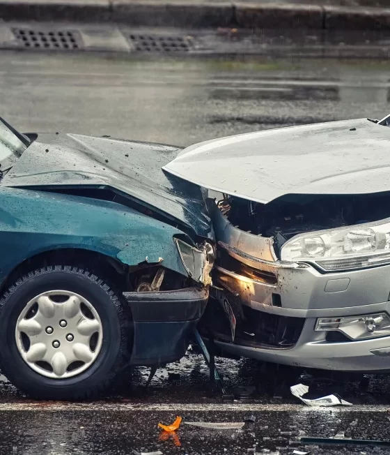 Woman looking at damage on car