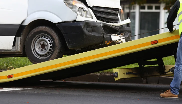 Company van on tow truck after accident.