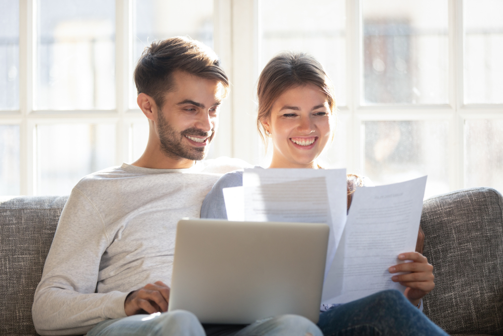 couple looking over insurance documents on computer