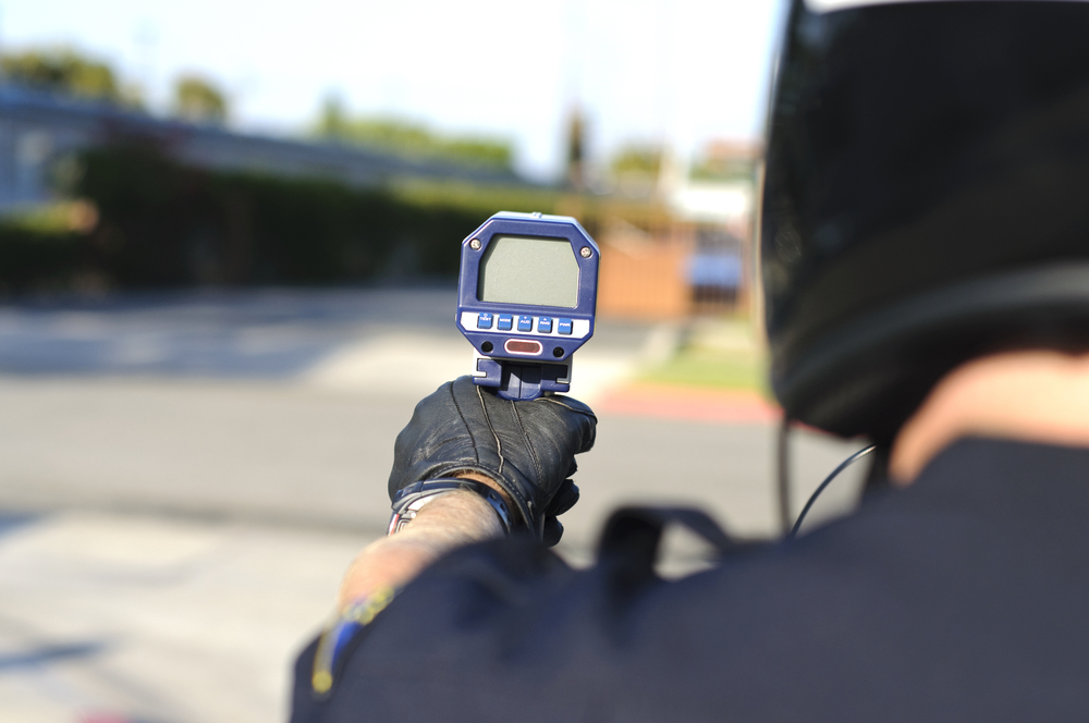 police officer with radar gun