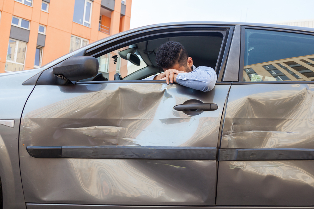 Man when realized his car got crashed by a hit-and-run car