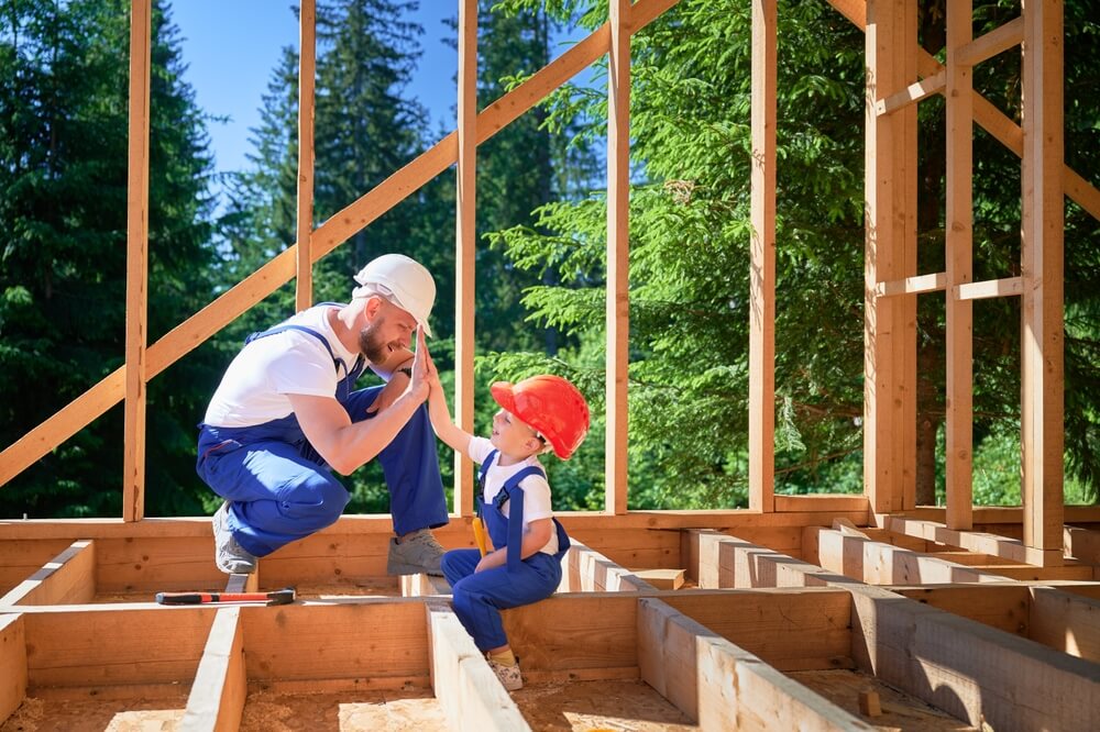 Father and son on the building site of their home in Georgia.