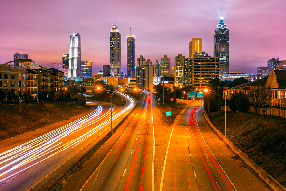 Blurred image showing fast cars on highways around Atlanta - cheap car insurance in Georgia.