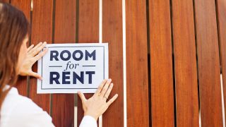 Woman putting a sign 