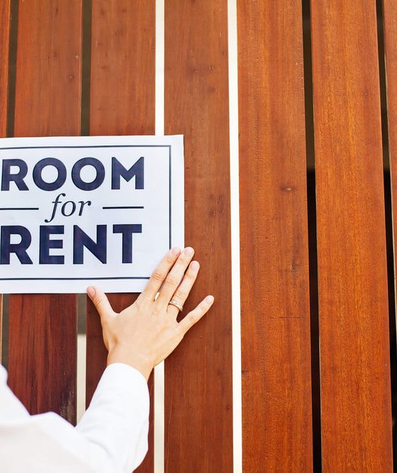 Woman putting a sign 