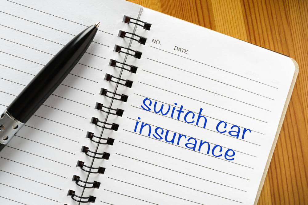 Notepad with note on it: switch car insurance.