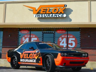 Velox Insurance branded car.