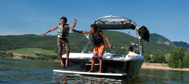 Two children playing in a boat.