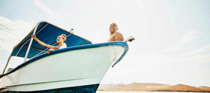 Man and woman resting in their boat.