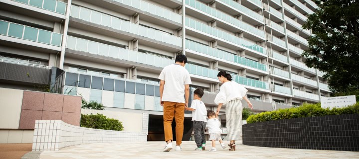 Family in front of their condo.