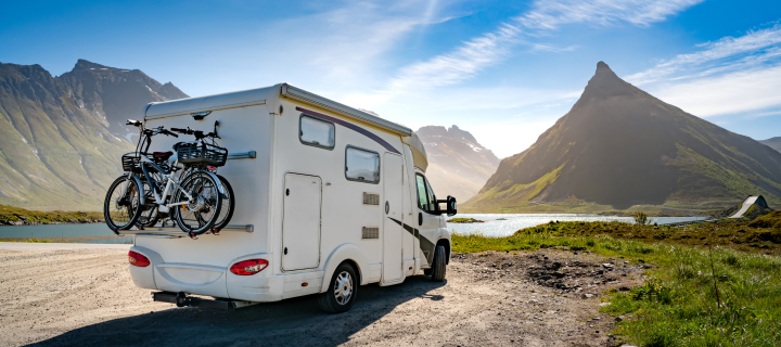 RV parked in front of a landscape.