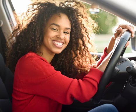 Woman smiles as she drives