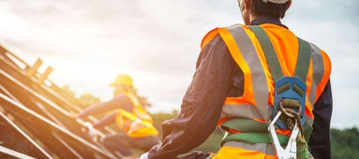 Photograph of people working on a construction site.