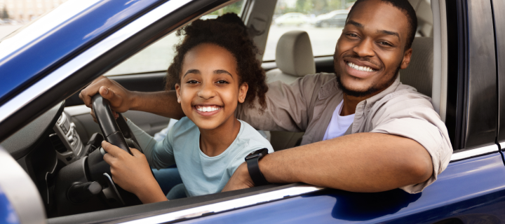 Happy Black Daddy Teaching Preteen Daughter To Drive.