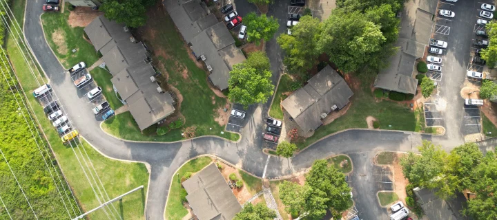 An aerial shot of the buildings and streets of Atlanta, Norcross: Cheap car insurance in Calhoun, Georgia.