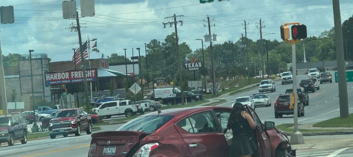 Statesboro, GA USA: Car Accident at Intersection in Statesboro with one in the middle of intersection.