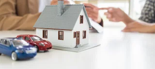 Concept of home and car insurance together. Bundling insurance policies.